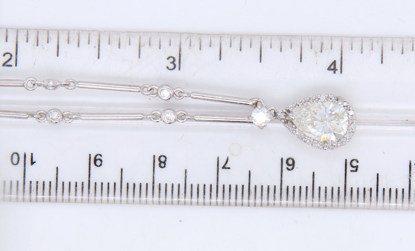 18kt White gold pear shaped laser treated in 0.75ctw bezel set diamond bar necklace