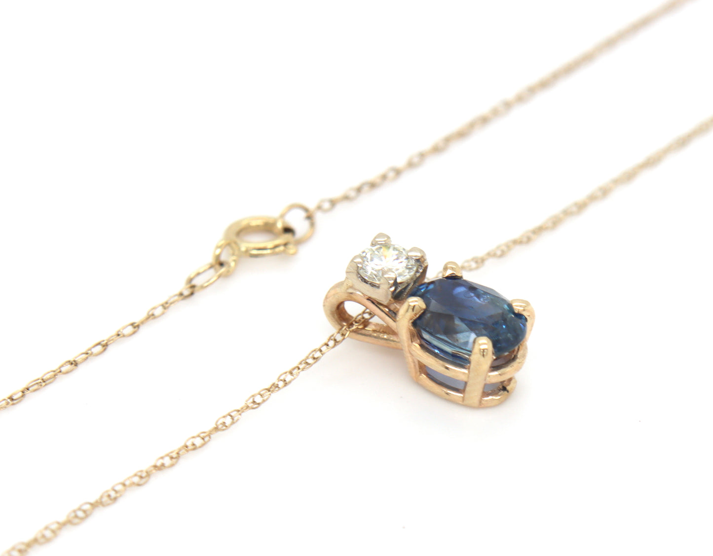 10kt Yellow gold 1.10ct oval sapphire and diamond pendant on chain