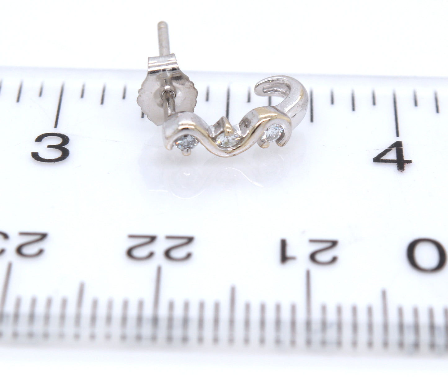 14kt White gold diamond swirl stud earrings