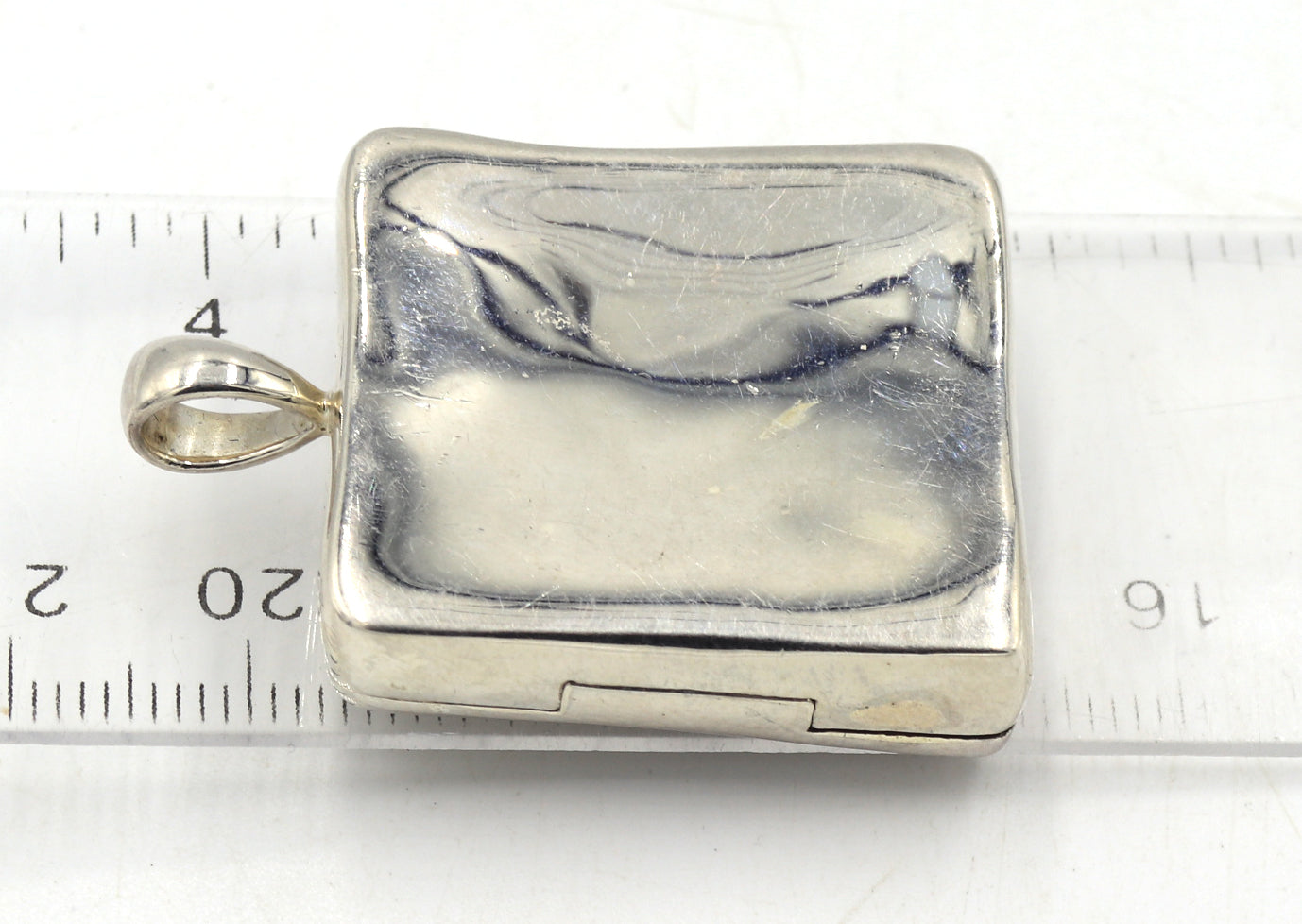 Group lot of 4 925 sterling silver signed pendants