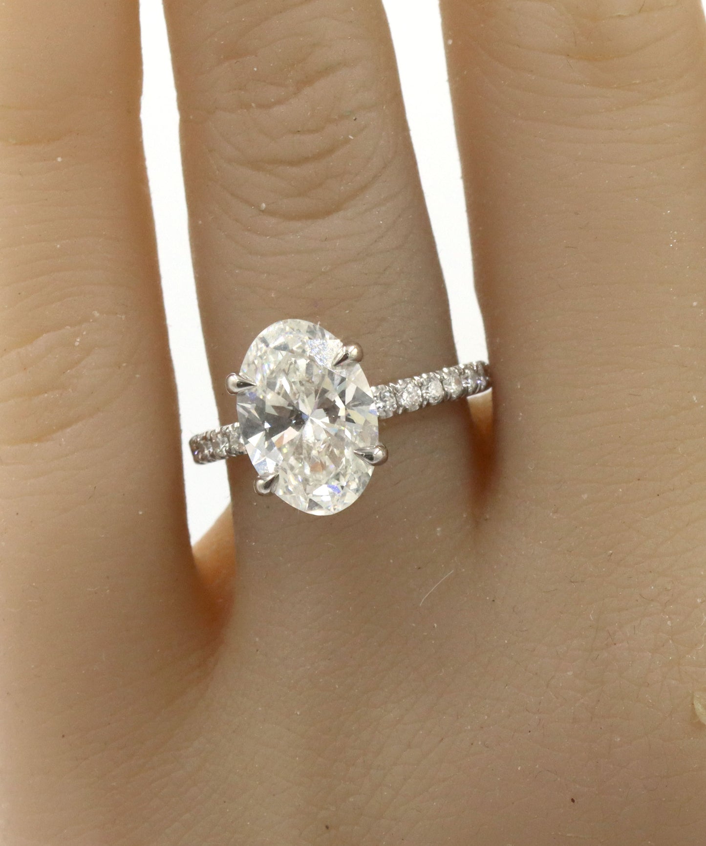 14kt White gold 3.15ct oval lab grown diamond in micro pave ring