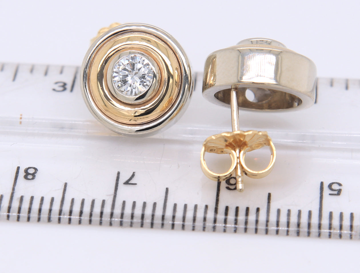 Attractive Two Tone Gold approximate 0.50ctw 2 Tone Bezel Set Diamond Earrings