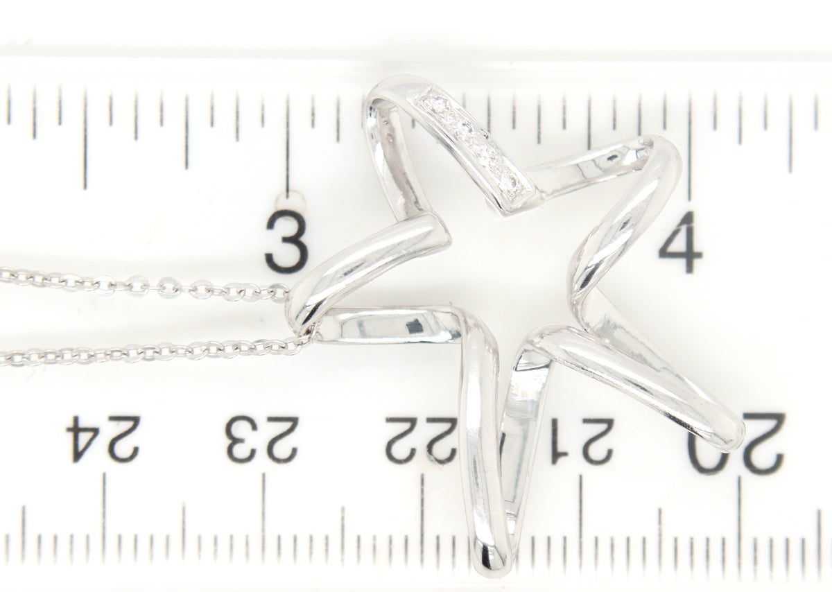 18kt White gold diamond accent free form star pendant on chain