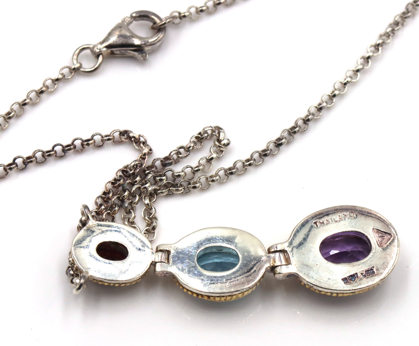 925 Sterling silver signed amethyst, blue topaz and garnet pendant on chain
