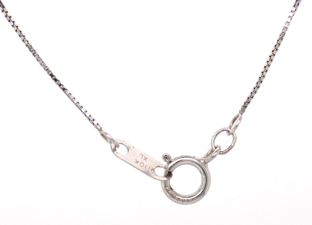 10kt White gold blue sapphire and diamond pendant on chain