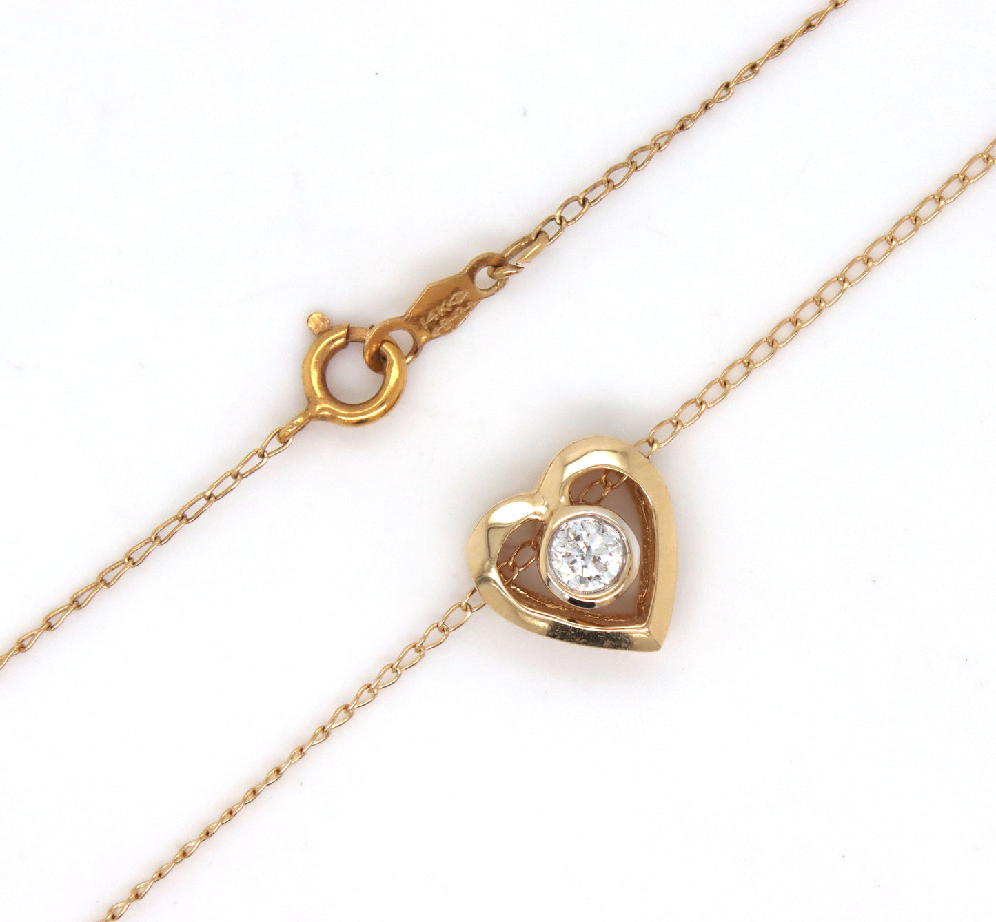 14kt Yellow gold 0.12ct bezel set diamond heart pendant on chain