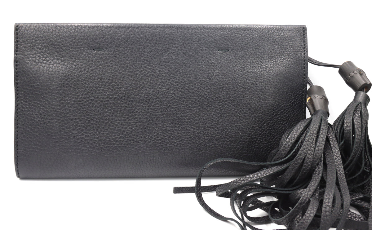 Gucci black leather clutch with Tassel