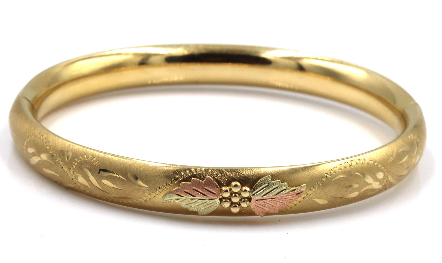 Gold plated flower engraved bangle bracelet