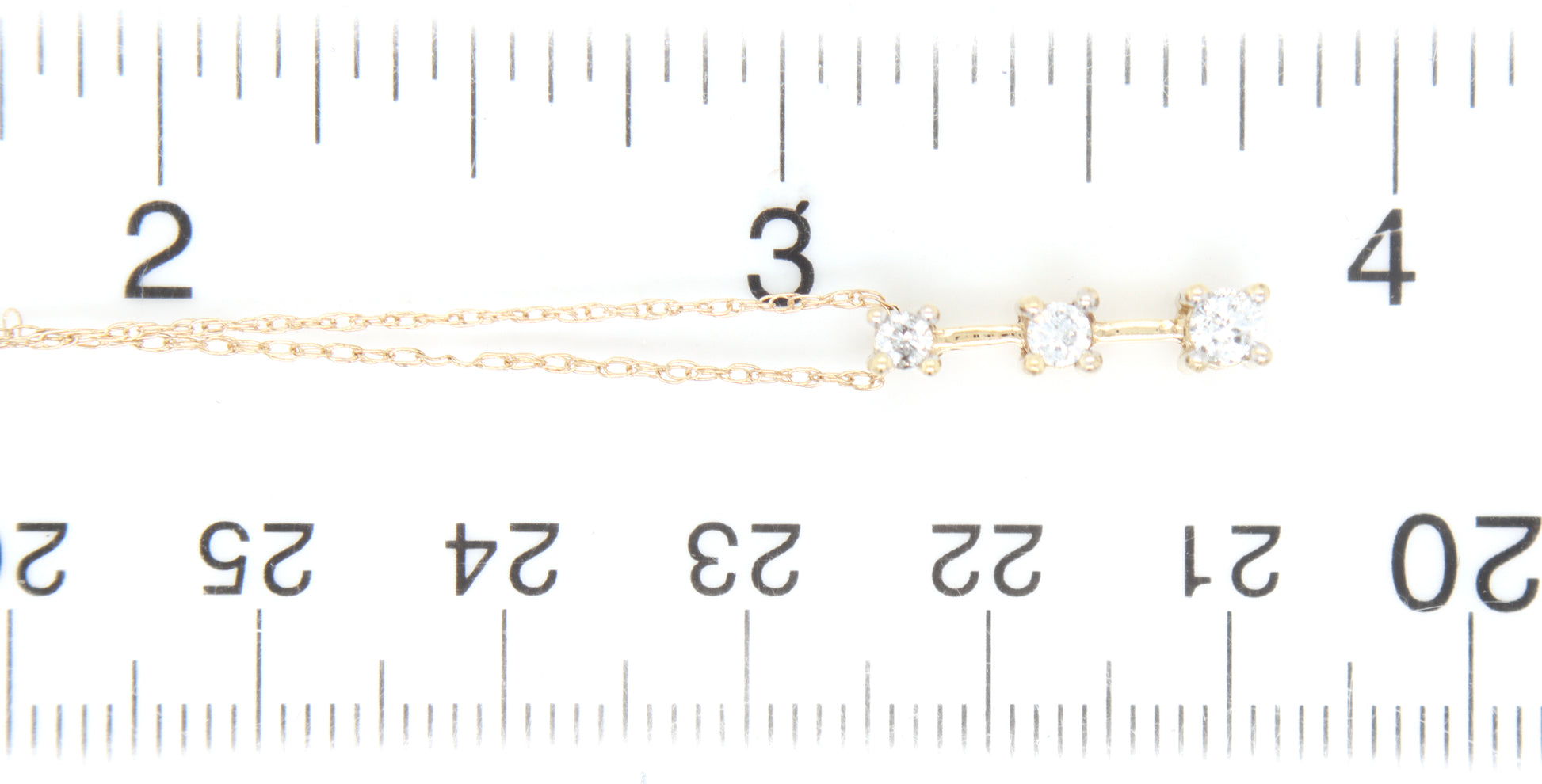 10kt Yellow gold 0.20ctw 3 stone diamond bar pendant on chain