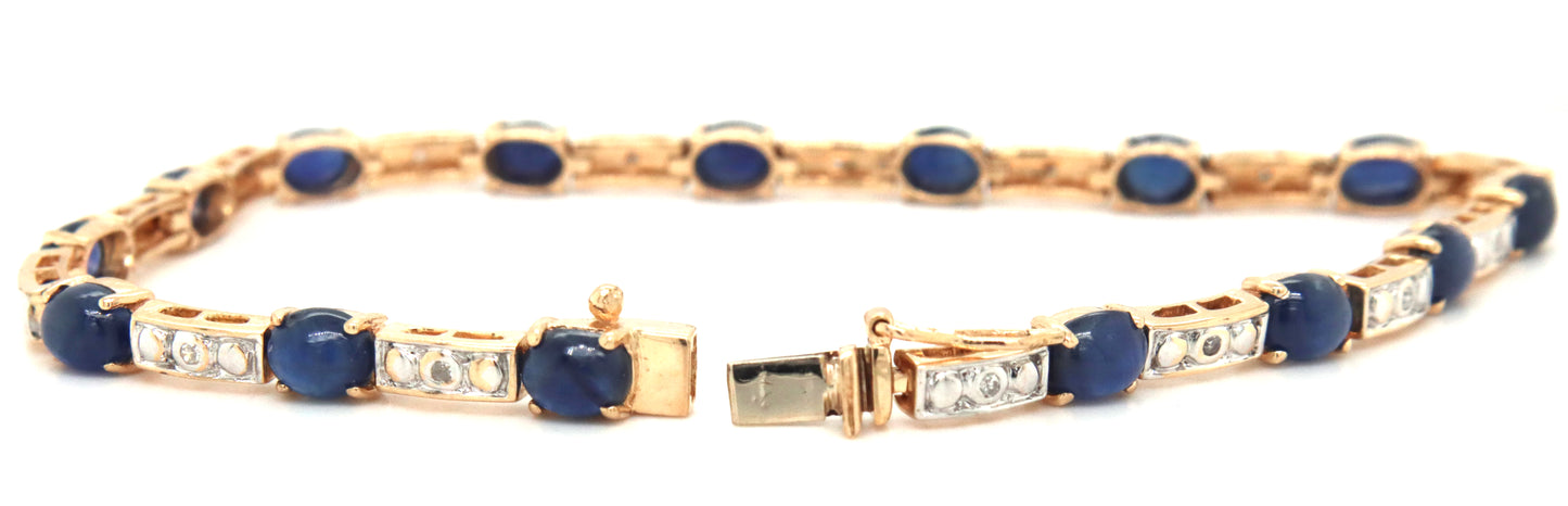 14kt Yellow gold 7.5ctw oval sapphire and diamond accent tennis bracelet