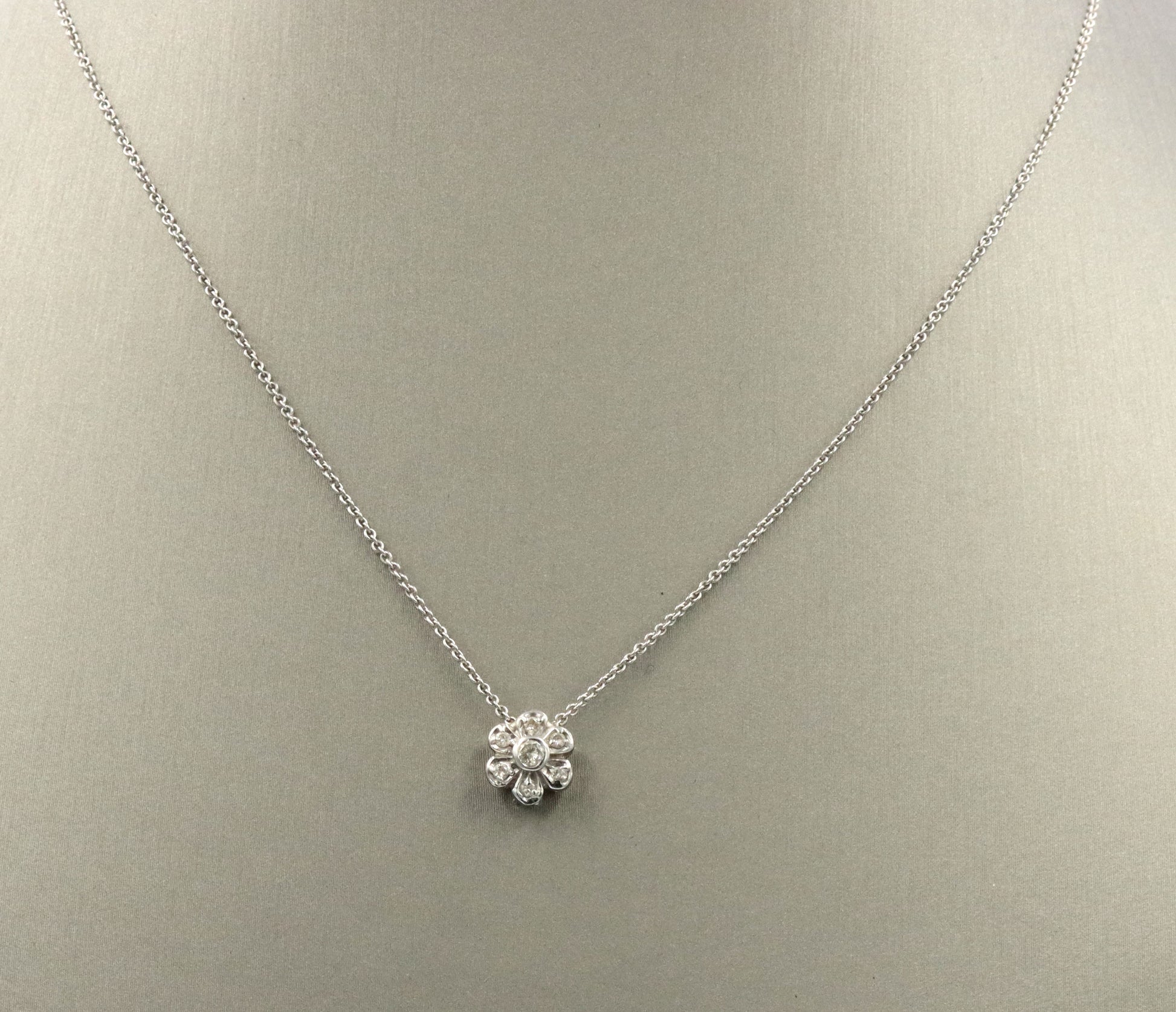 14kt White gold diamond flower style pendant on chain
