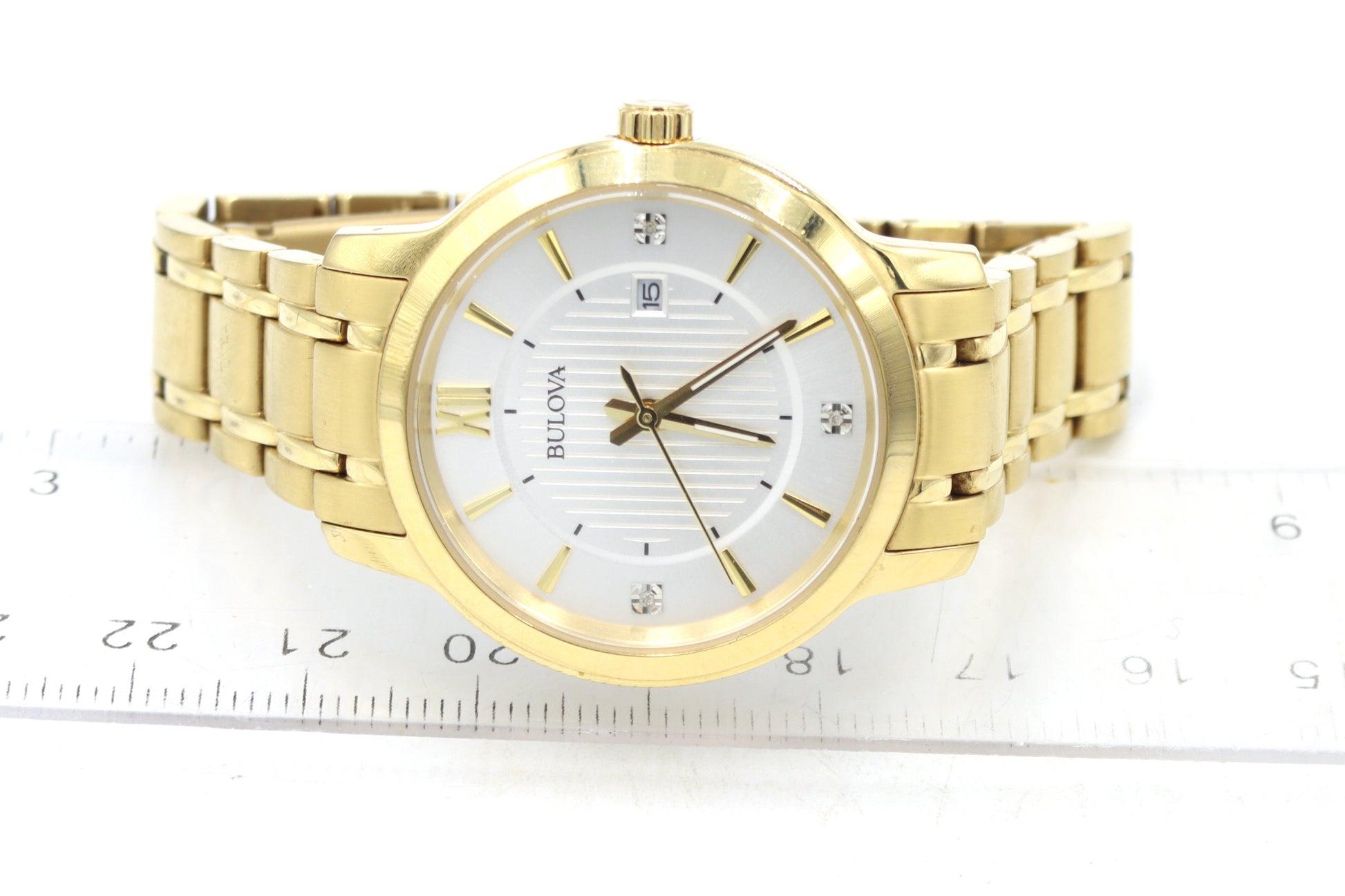 Bulova gold tone quartz round  watch