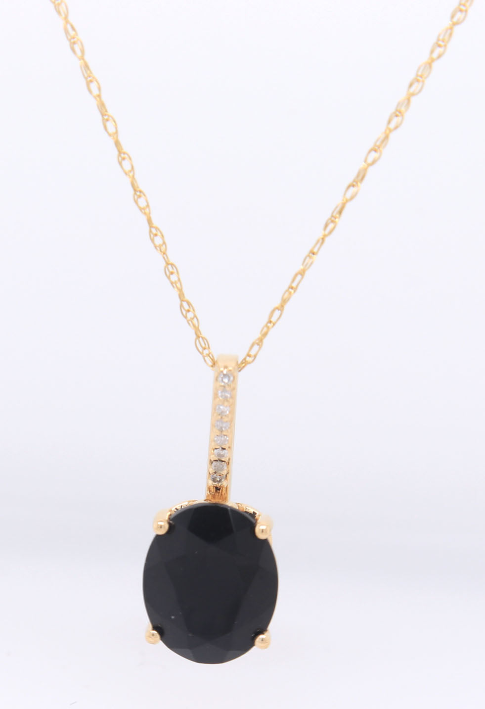 14kt Yellow gold oval black onyx and diamond pendant on chain necklace