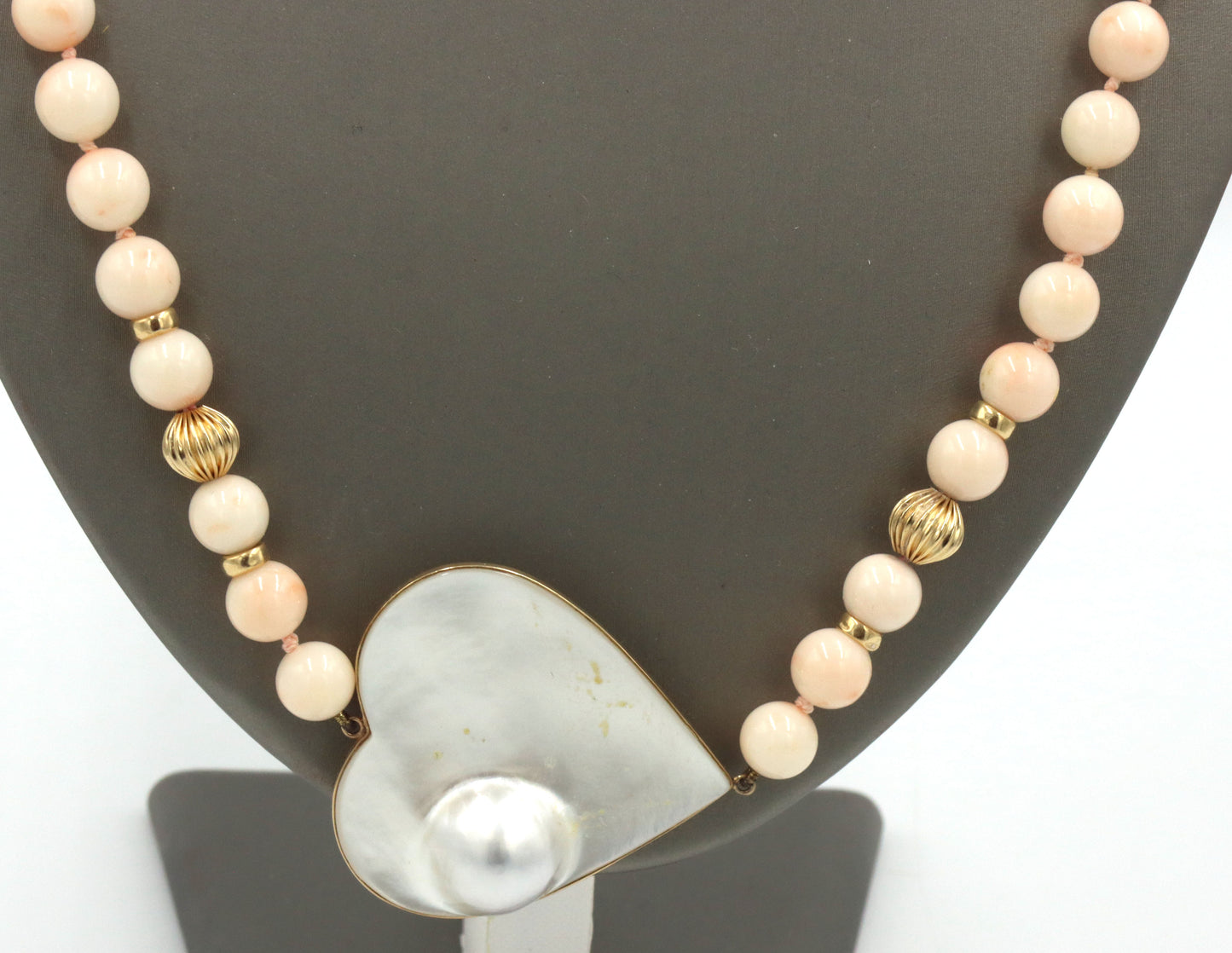 Pink quartz beaded necklace with mother of pearl heat shaped pendant