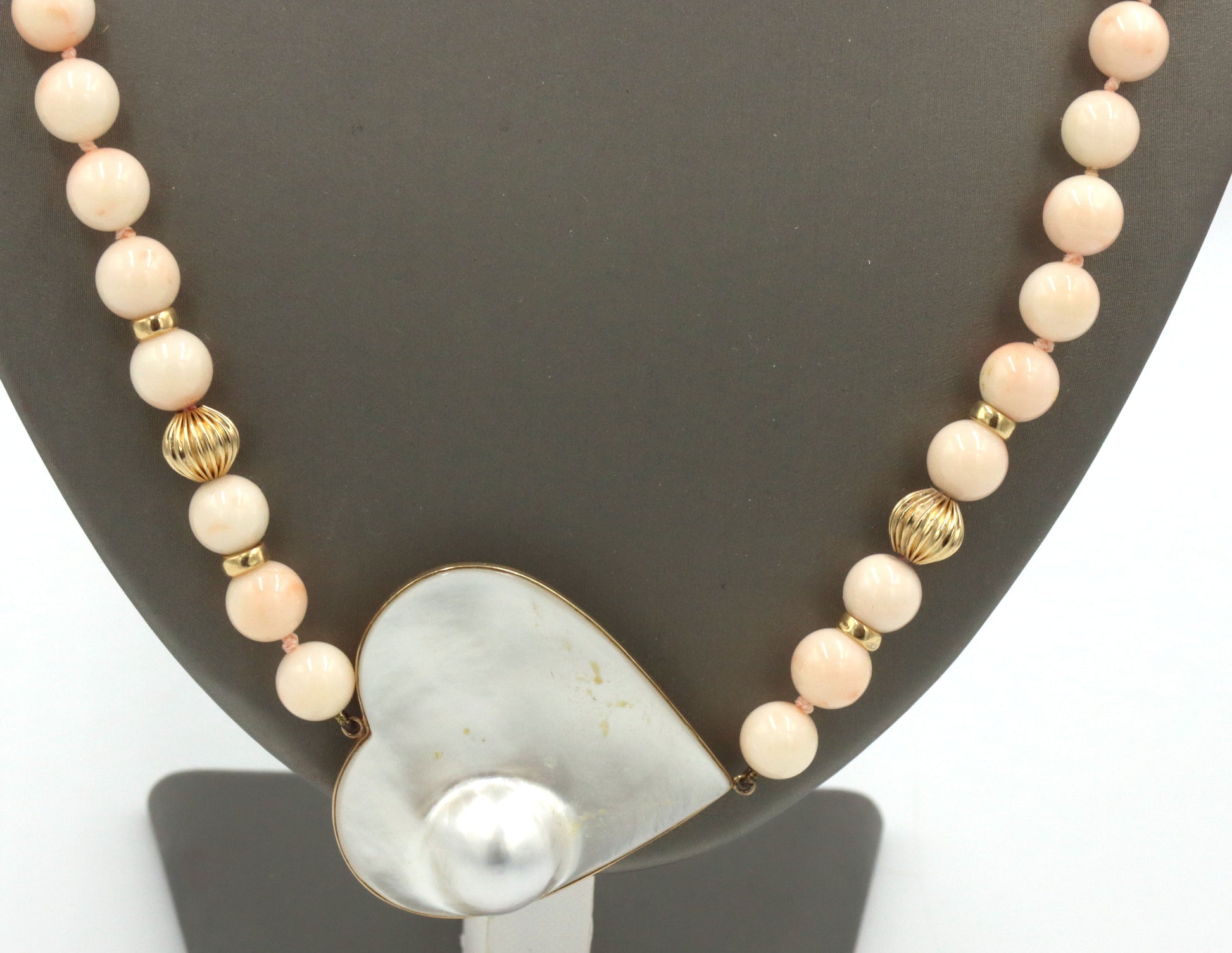 Pink quartz beaded necklace with mother of pearl heat shaped pendant