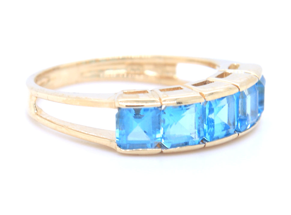 14kt Yellow gold channel set princess cut blue topaz five stone band