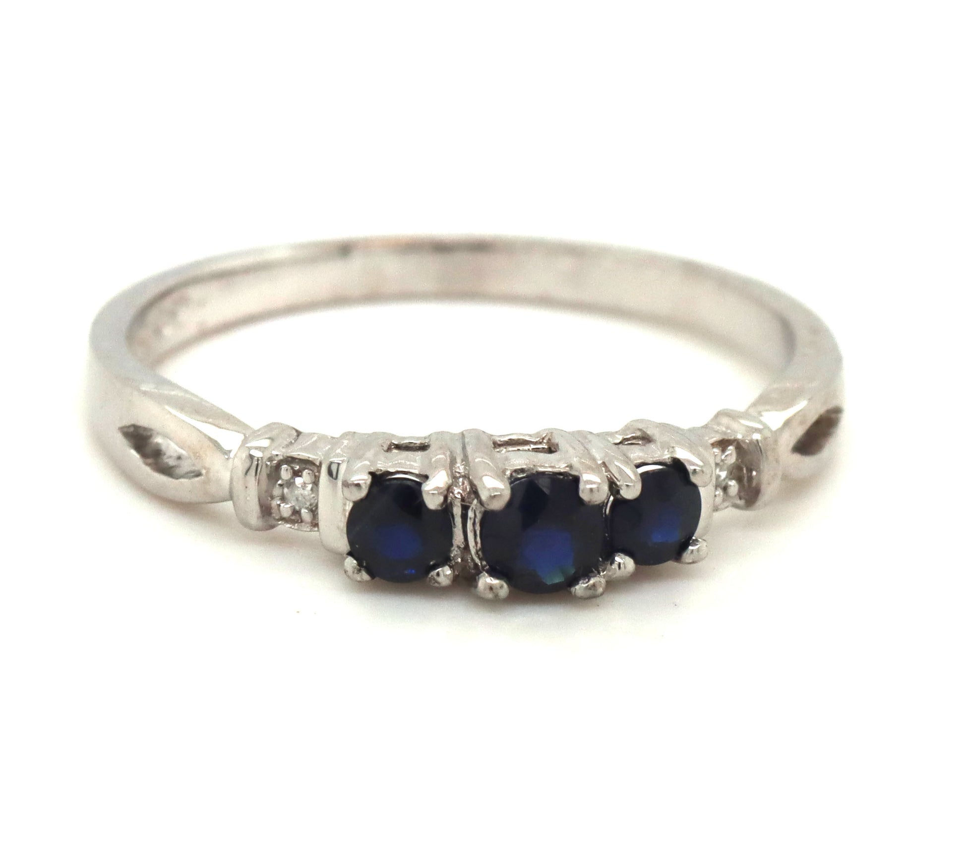 10kt White gold 3 stone sapphire and diamond accent ring