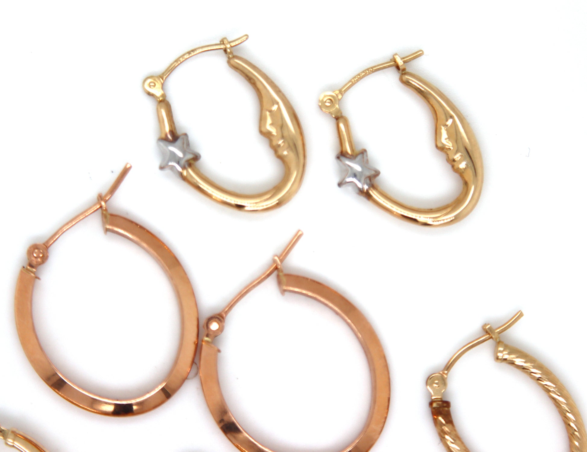 4 Pairs of 14kt yellow gold hoop earrings