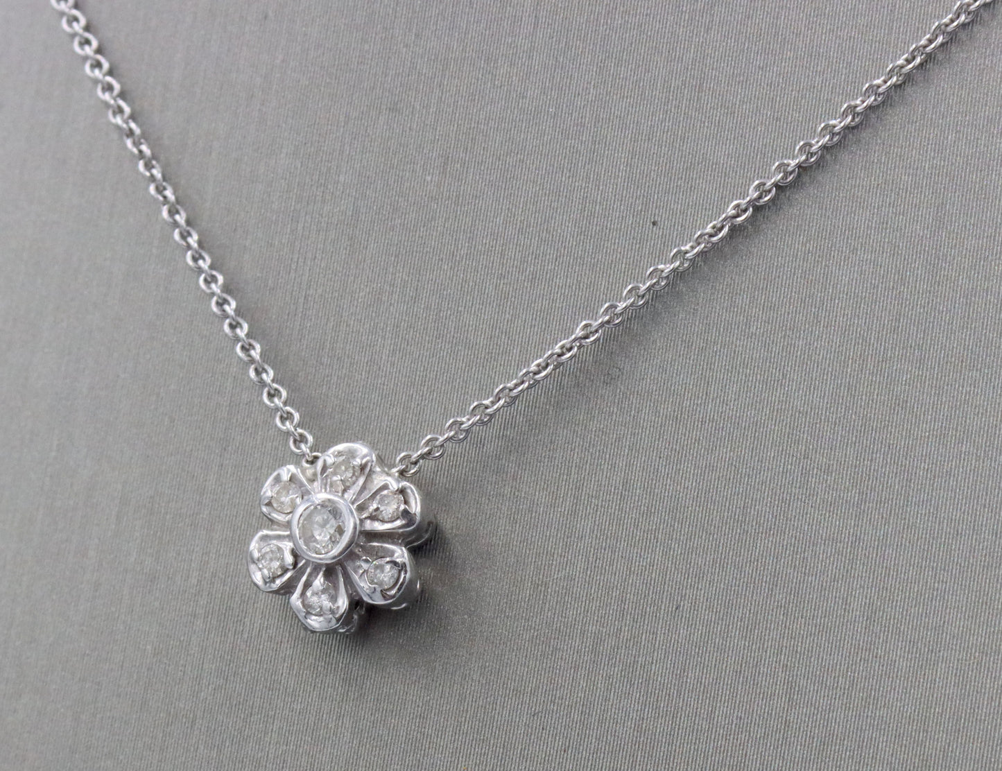 14kt White gold diamond flower style pendant on chain