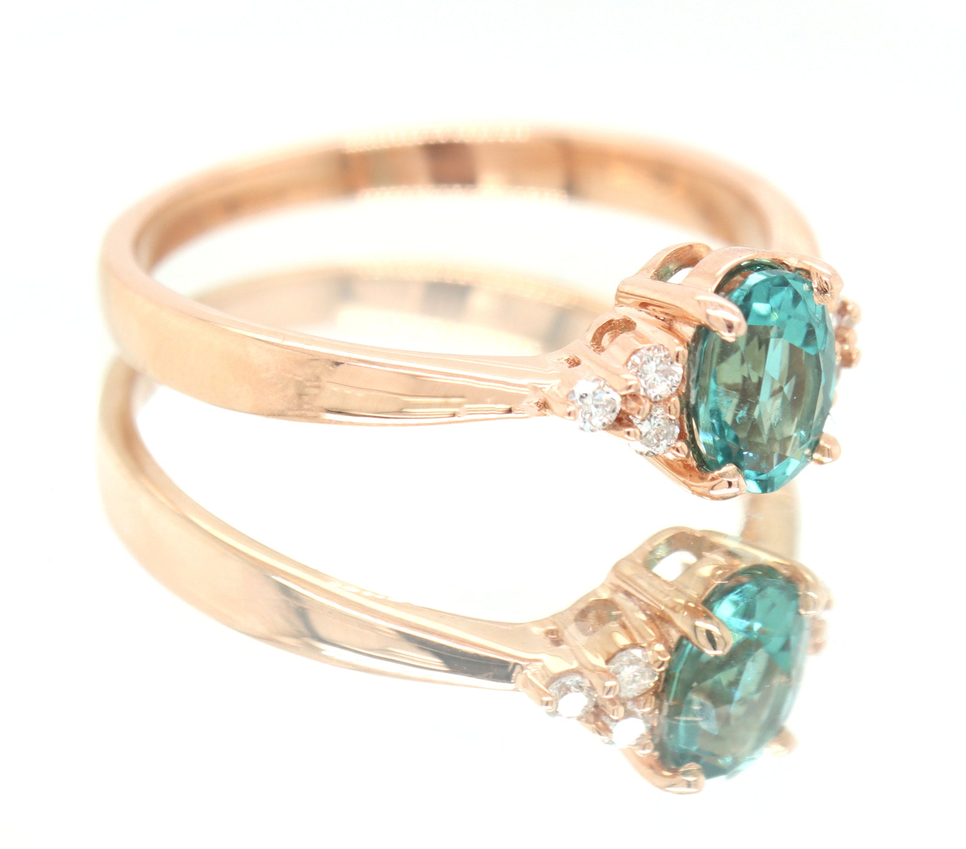 14kt Rose Gold oval Blue Zircona and Diamond Ring