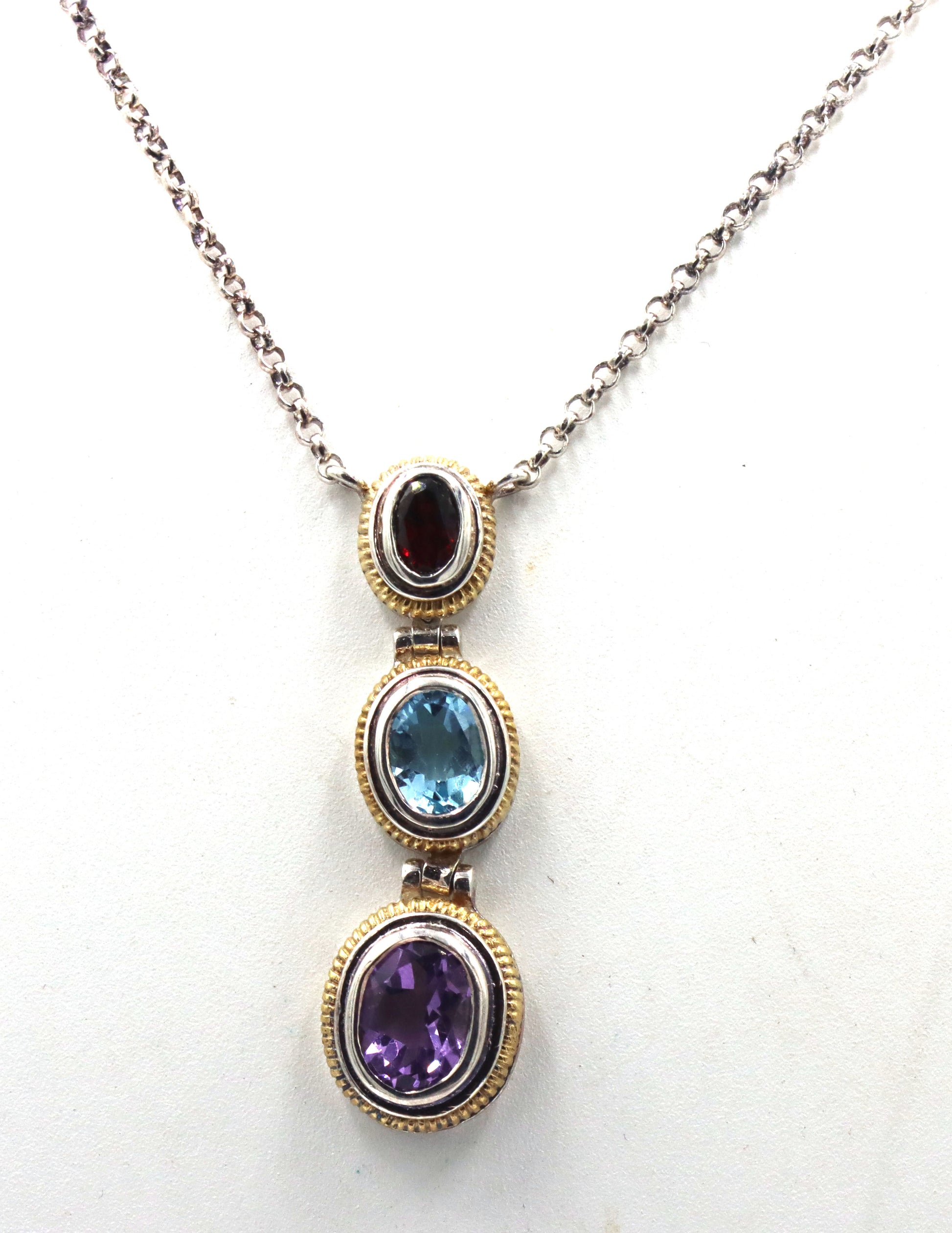 925 Sterling silver signed amethyst, blue topaz and garnet pendant on chain