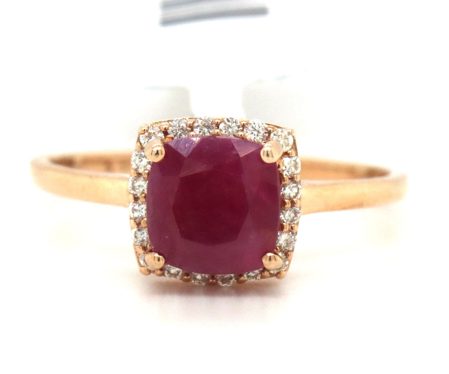 10kt Yellow gold cushion cut ruby and diamond halo ring