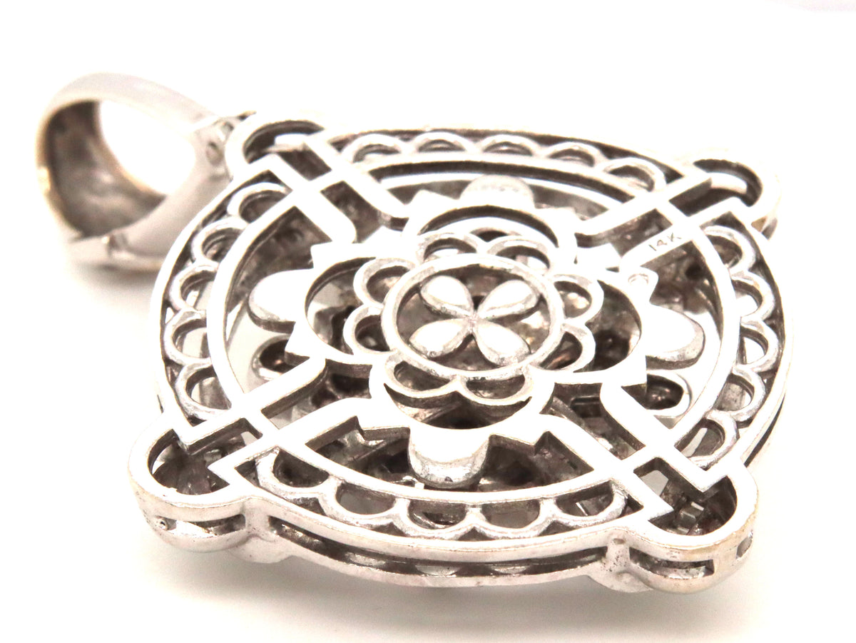 14kt White gold round brilliant and emerald cut diamond pendant