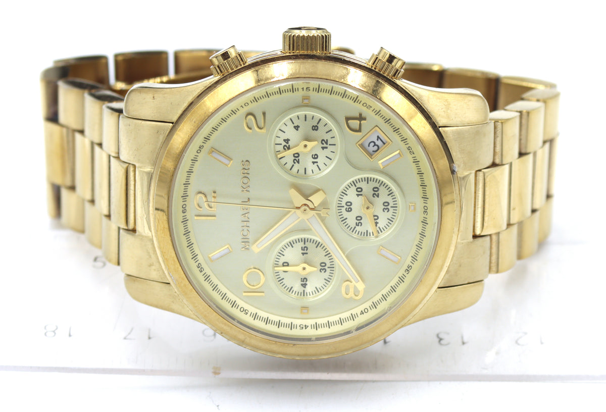 Micheal Kors mid size Chronograph gold tone watch