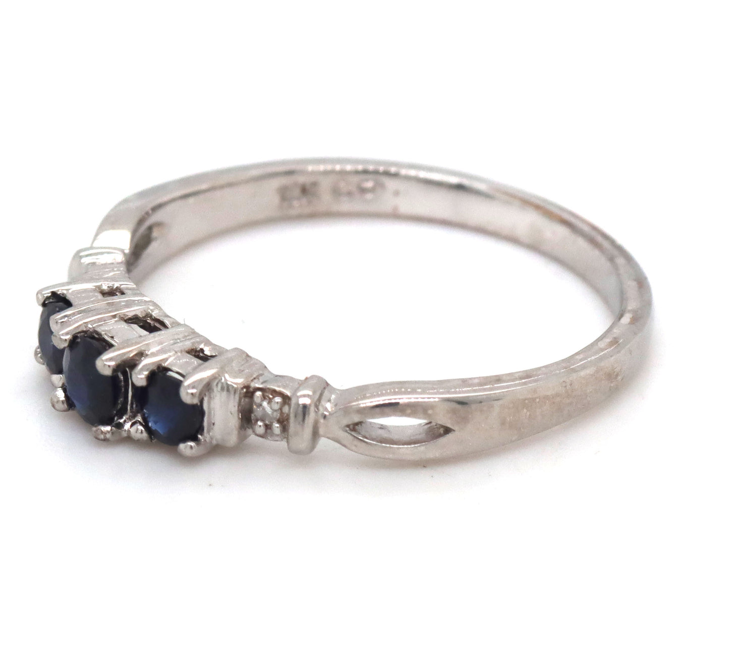 10kt White gold 3 stone sapphire and diamond accent ring