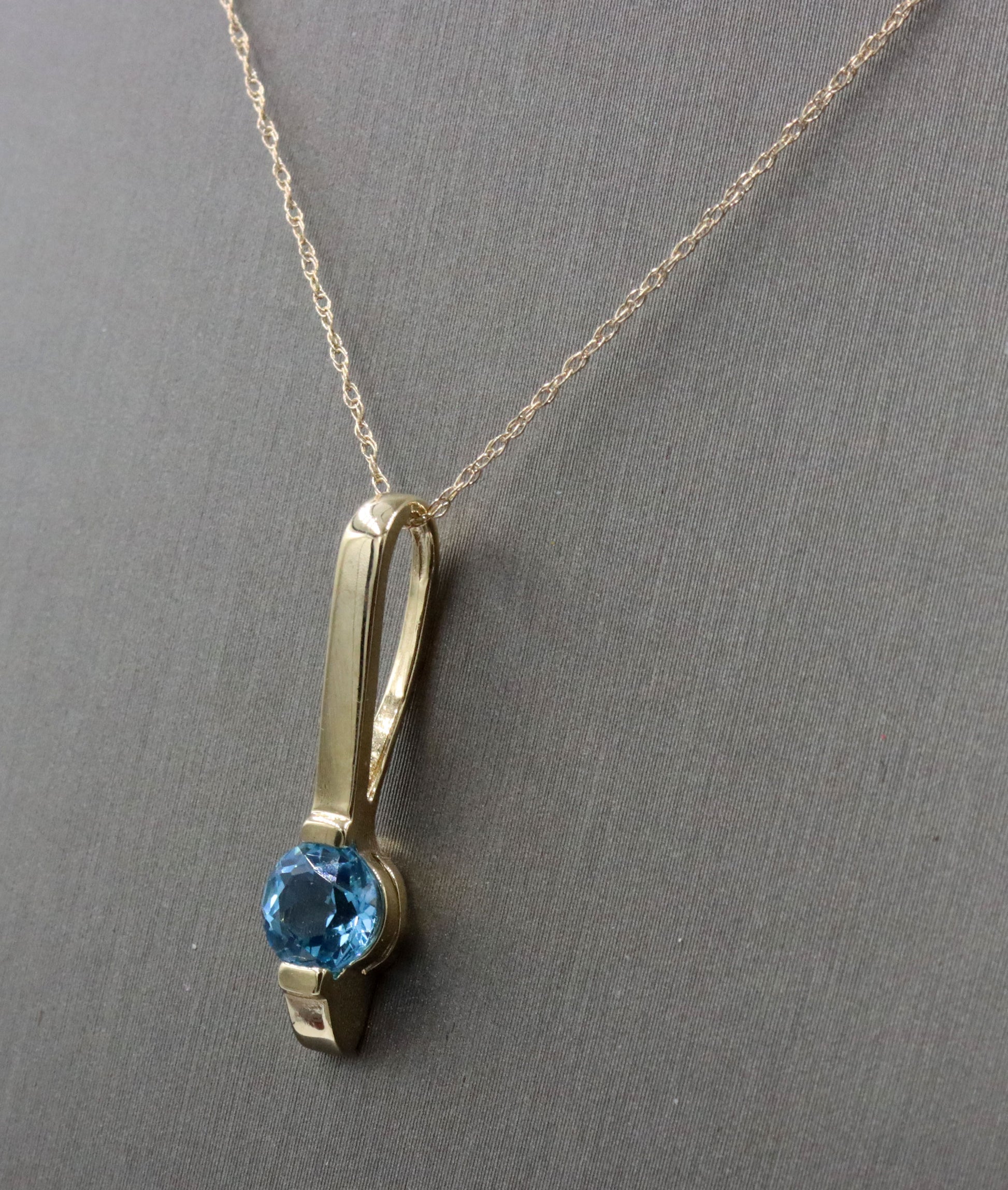 14kt Yellow gold blue topaz bar pendant on chain