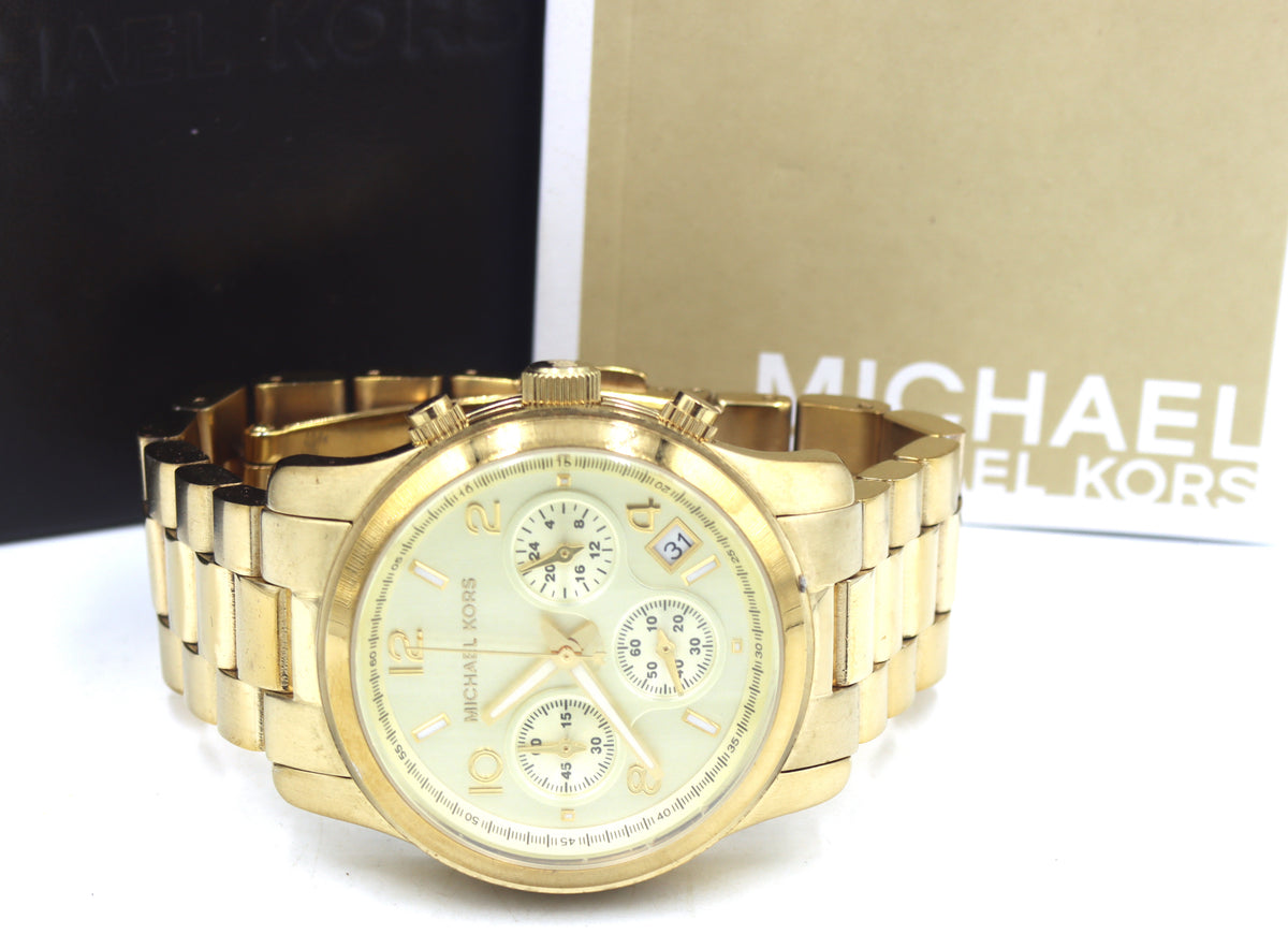 Micheal Kors mid size Chronograph gold tone watch