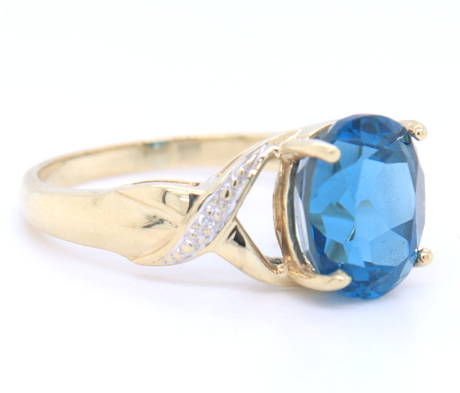 Fantastic Yellow Gold oval Blue Topaz and Diamond Ring