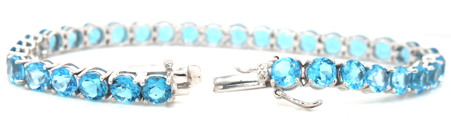 14kt White gold blue topaz link bracelet