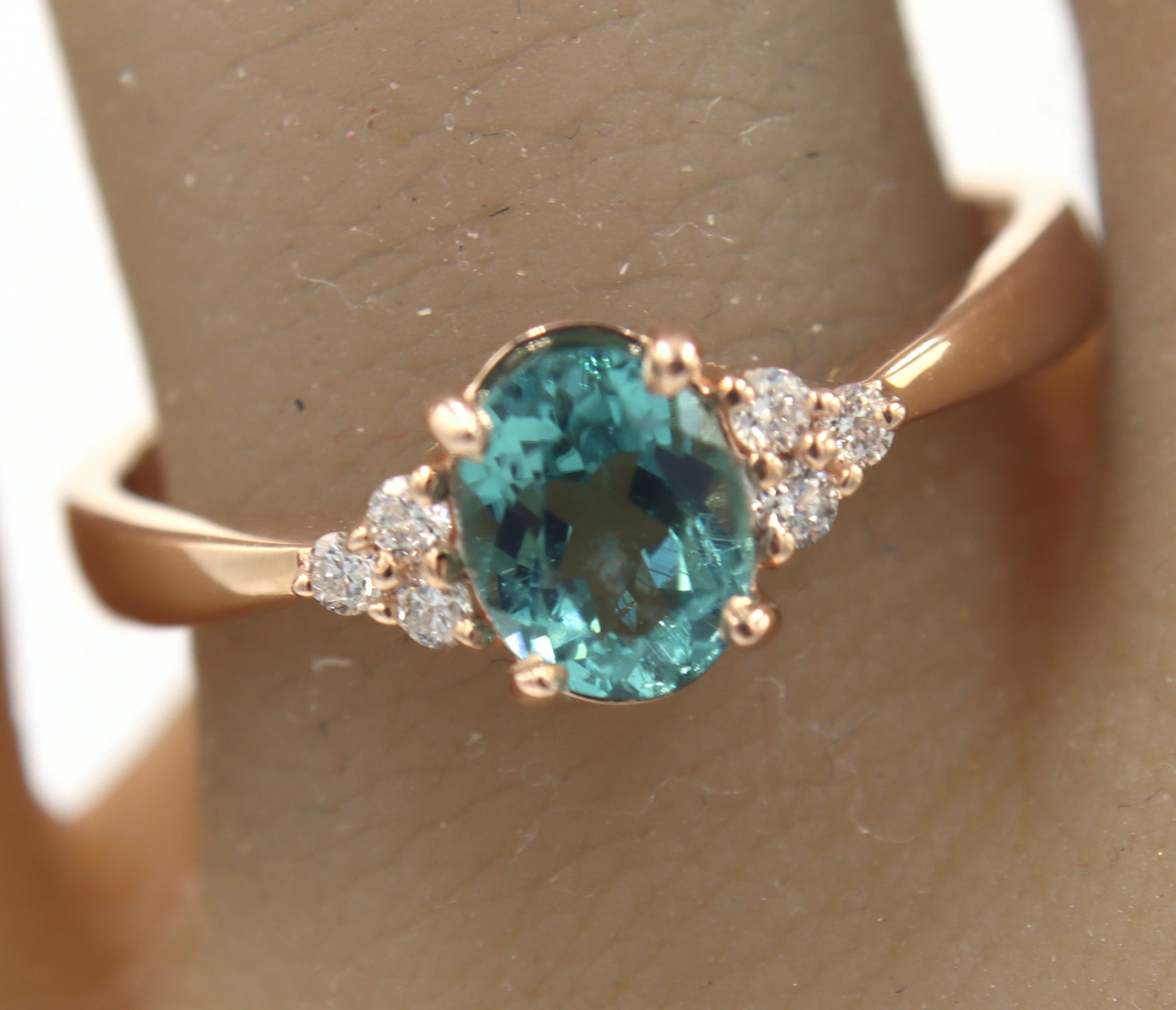 14kt Rose Gold oval Blue Zircona and Diamond Ring