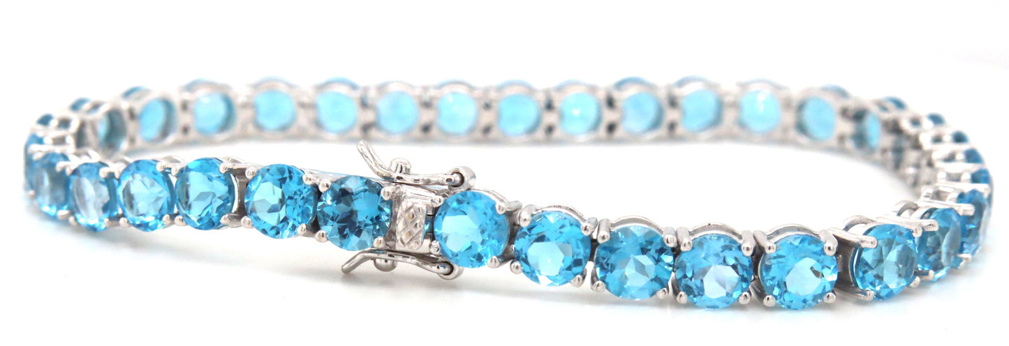 14kt White gold blue topaz link bracelet