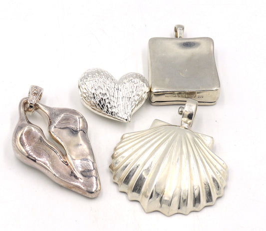 Group lot of 4 925 sterling silver signed pendants