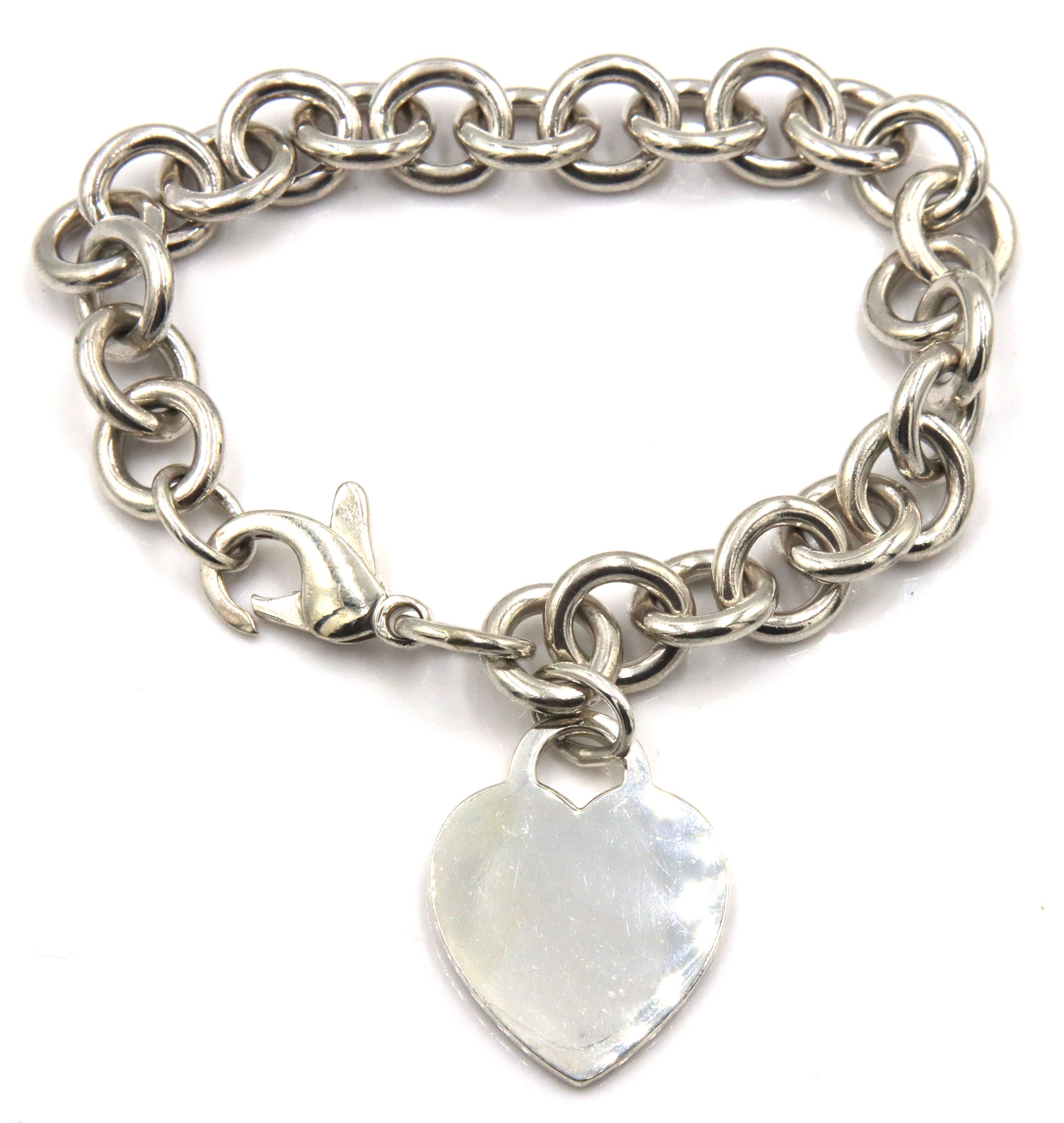 Tiffany & Co link bracelet with heart shaped charm