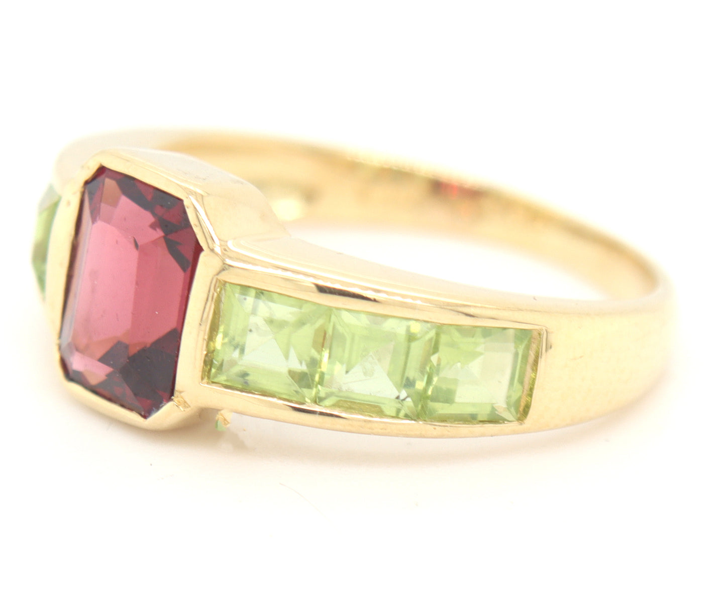 18kt Yellow gold Emerald cut garnet and square peridot bezel set ring