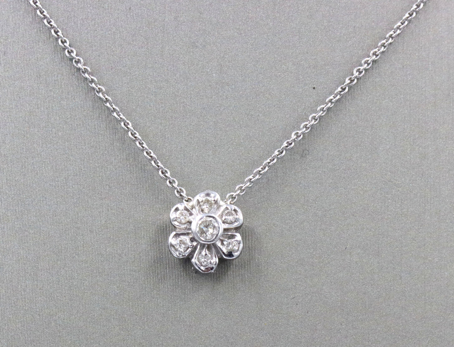 14kt White gold diamond flower style pendant on chain