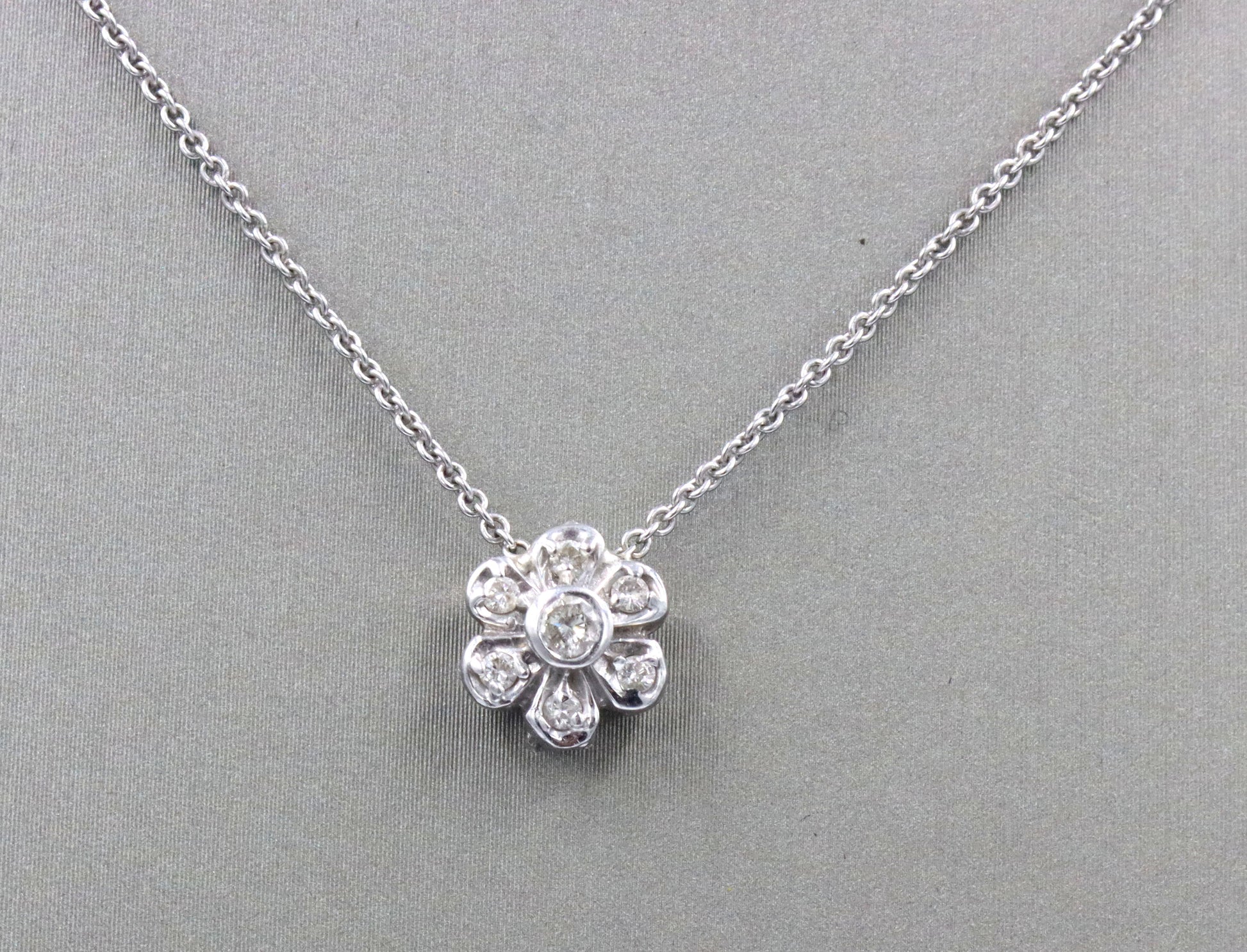 14kt White gold diamond flower style pendant on chain