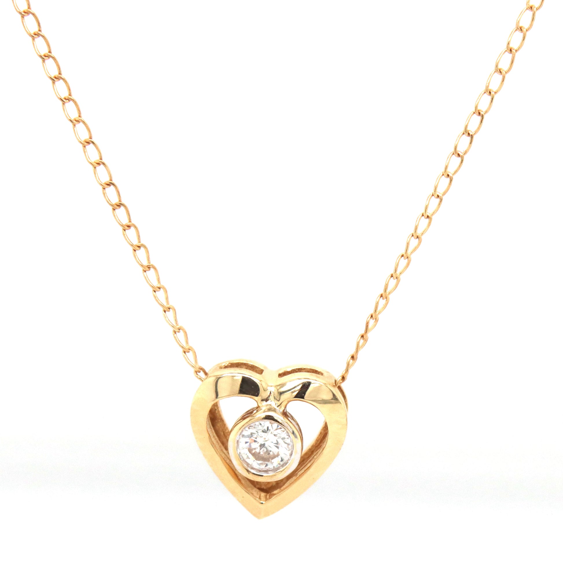 14kt Yellow gold 0.12ct bezel set diamond heart pendant on chain