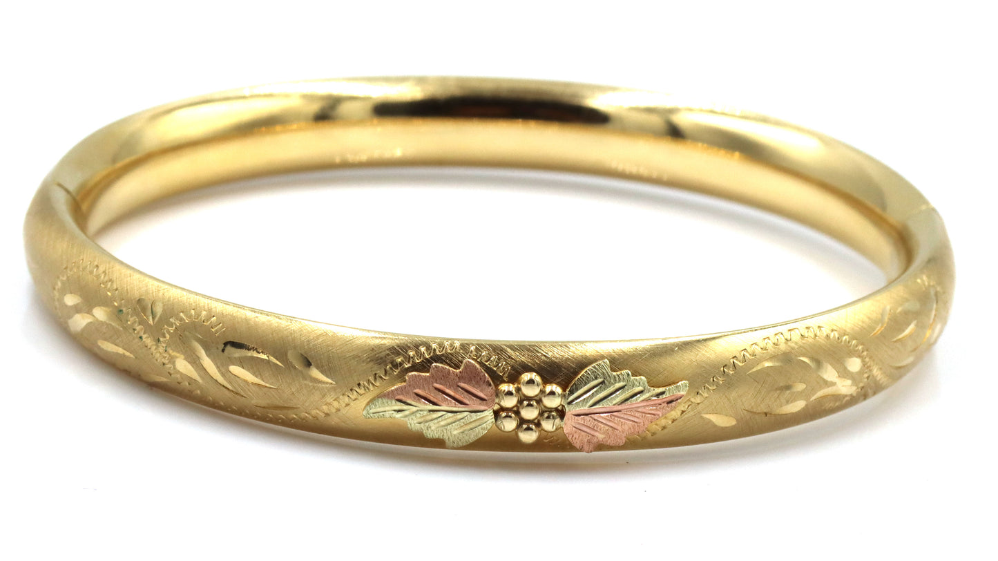 Gold plated flower engraved bangle bracelet