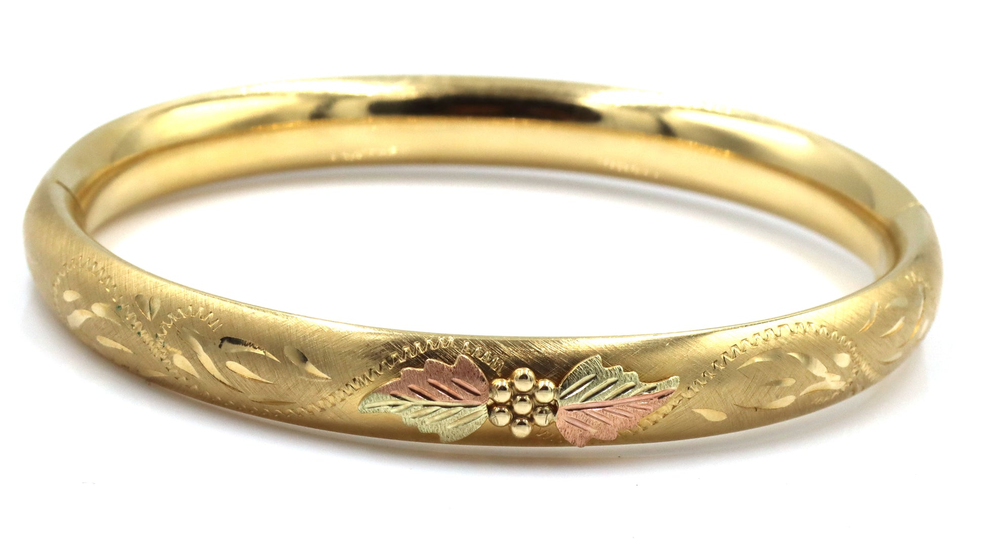 Gold plated flower engraved bangle bracelet