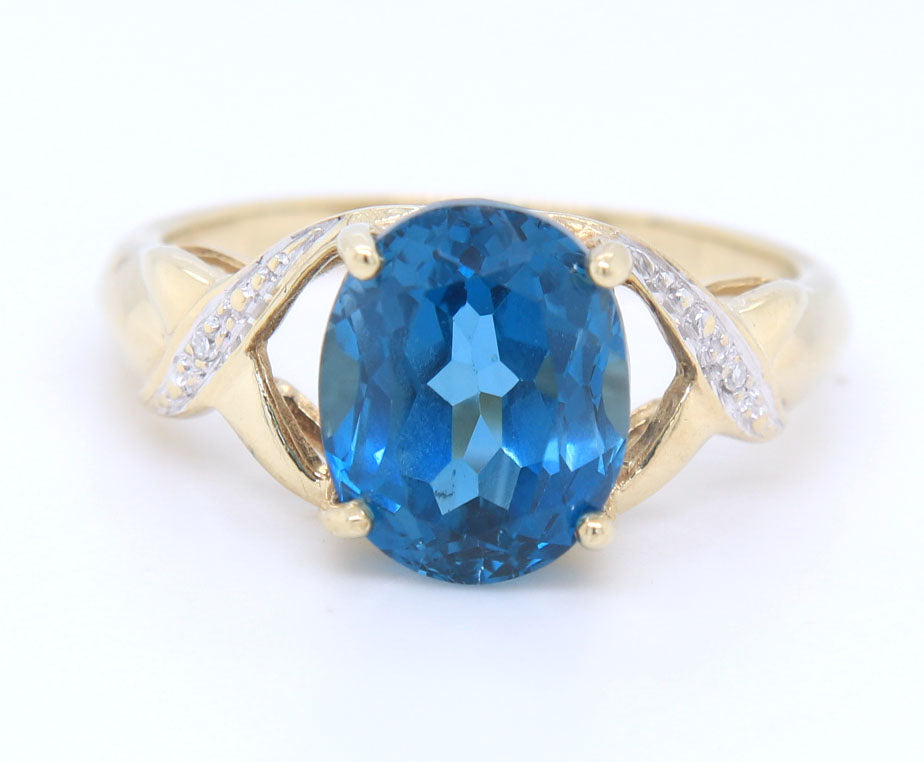 Fantastic Yellow Gold oval Blue Topaz and Diamond Ring
