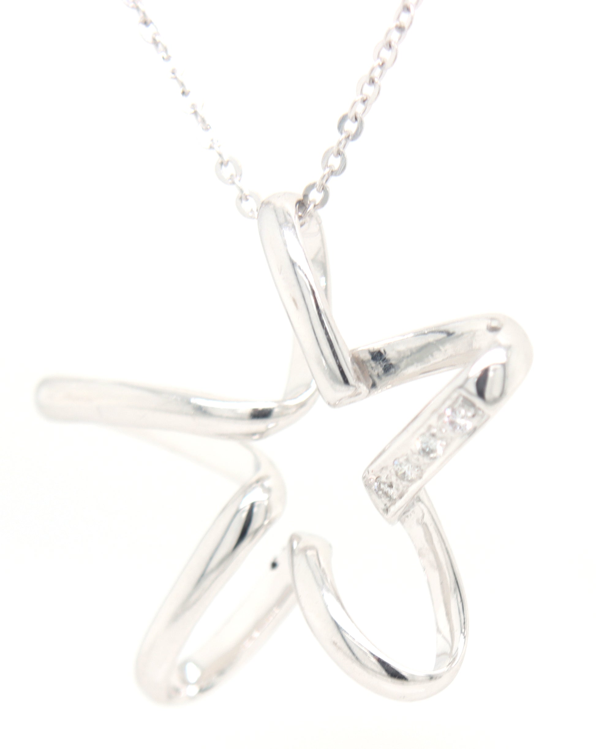18kt White gold diamond accent free form star pendant on chain