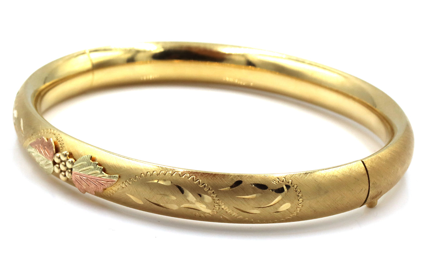 Gold plated flower engraved bangle bracelet