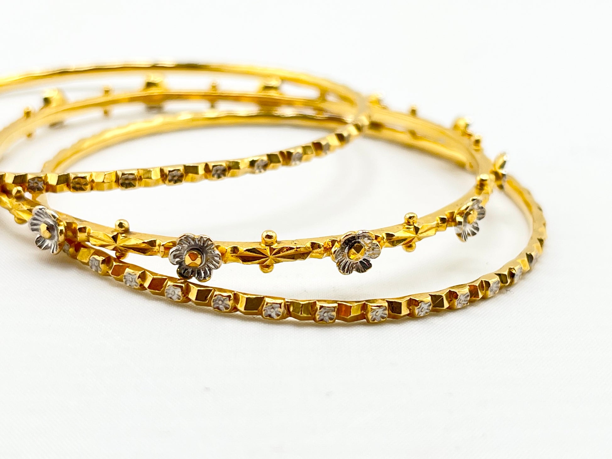 22KT Yellow Gold Hand Made Set Of Three Gold And White Flower Motifs Bangles