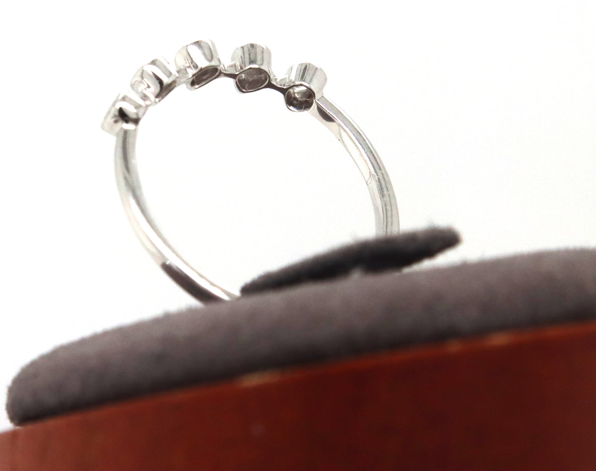 14kt White gold pear shaped bezel set diamond ring