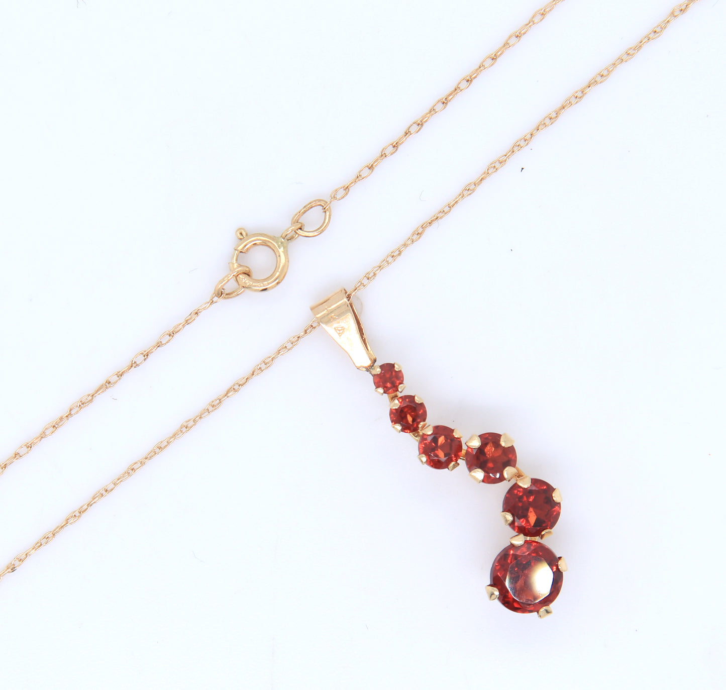 14kt Yellow gold garnet journey pendant on chain necklace