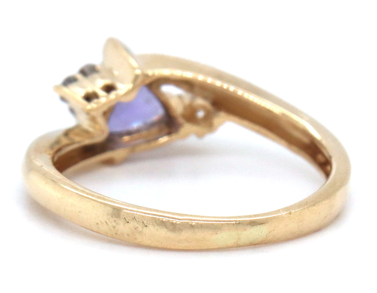 14kt Yellow gold trillion Tanzanite and diamond accent bypass ring